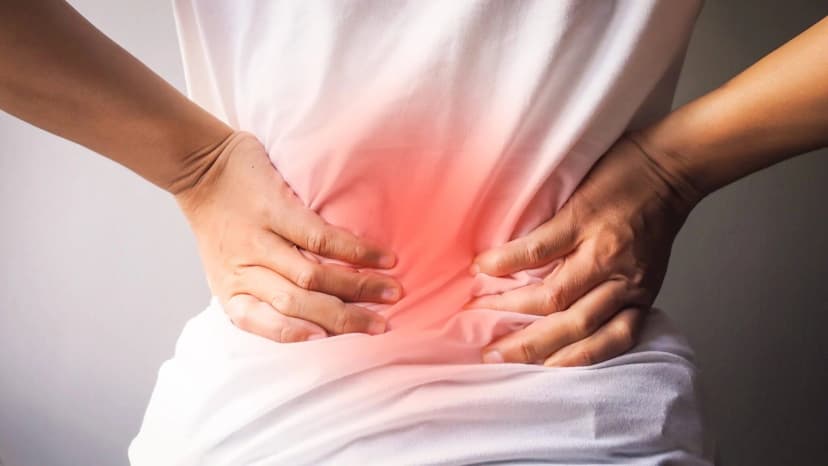 An image of a person's back indicating lower back pain