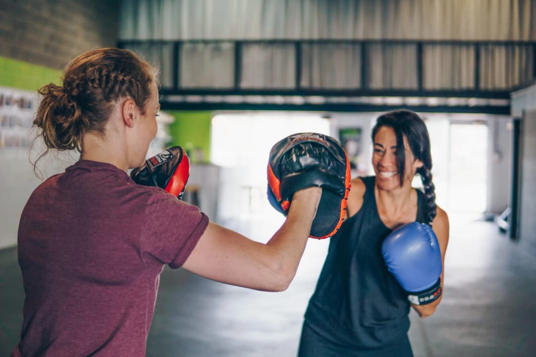 A person training with a heavy punching bag